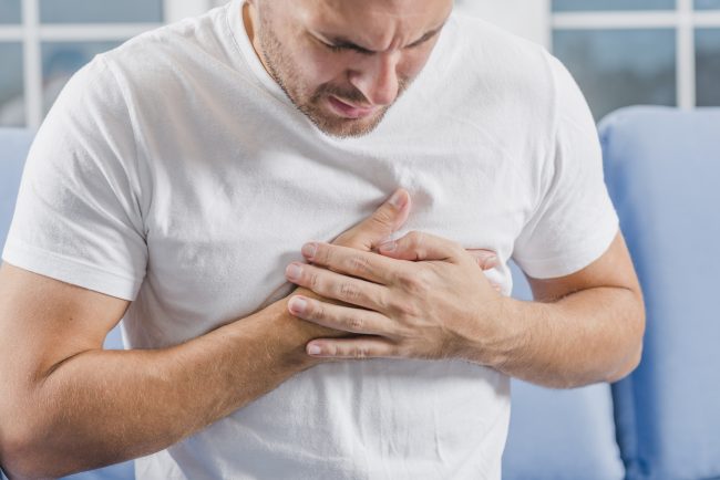 Man suffering pain in the chest