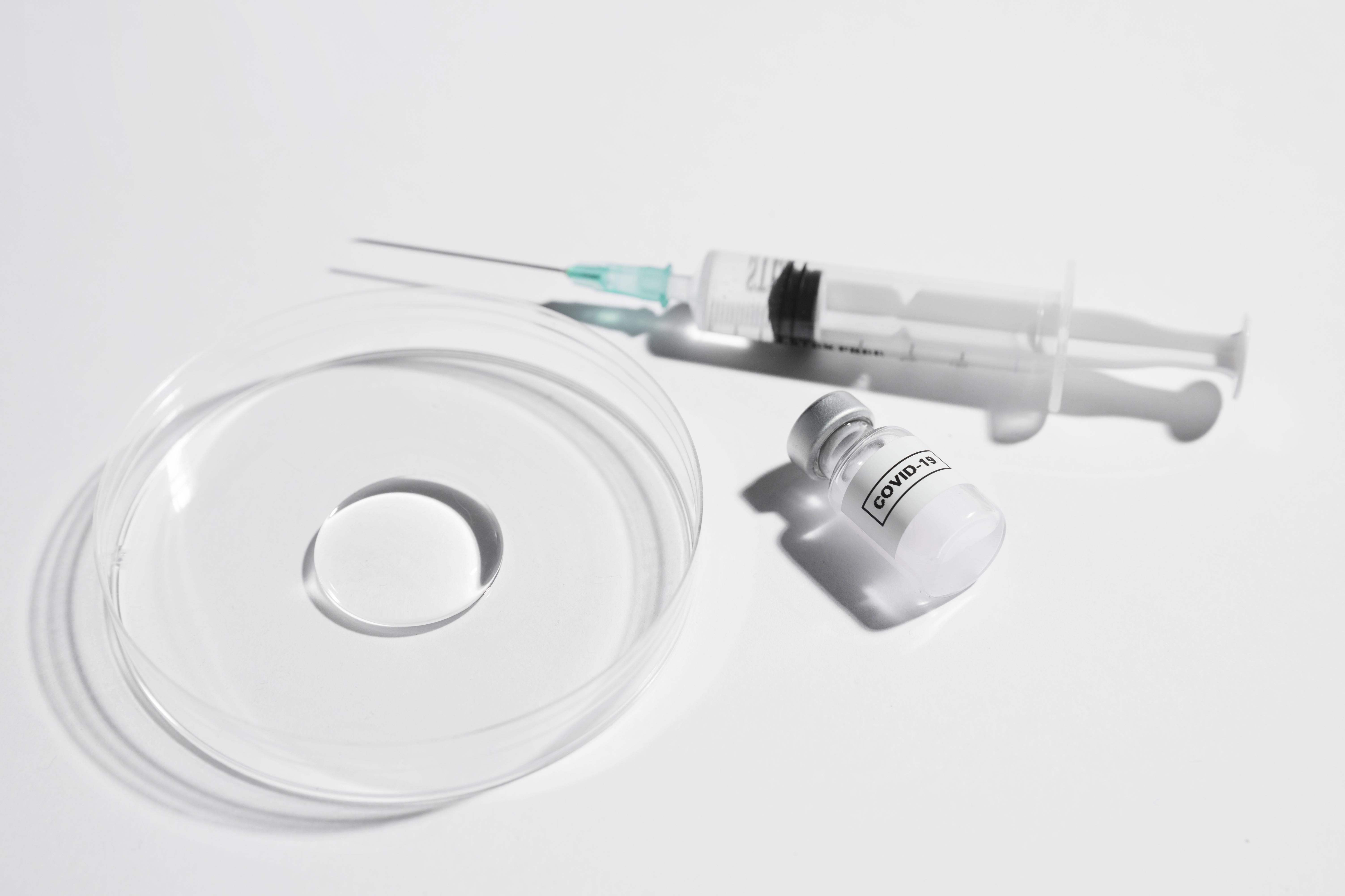 Syringe, medicine bottle, and a lab glassware