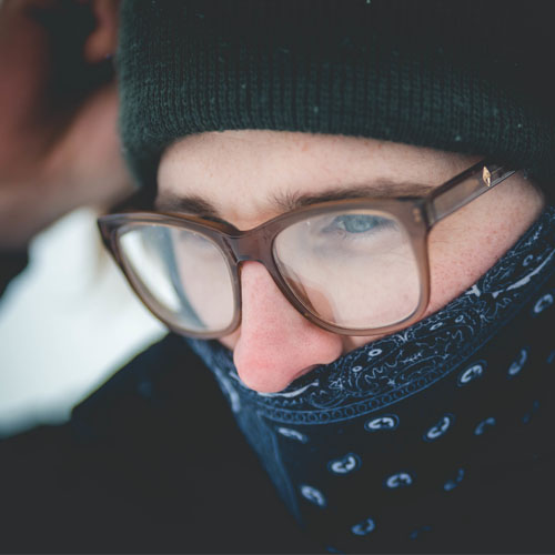 Man wearing eyeglasses and cloth face mask